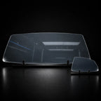 The large 150 by 90 cm sheet for a windscreen next to a side-window sheet, showing the size difference